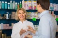 Male buyer consults with pharmacist