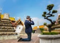 Male camerist taking picture of the temple