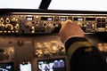 Male captain fixing altitude and longitude level on dashboard