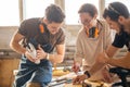 Carpenter Training Female Apprentice To Use Plane