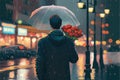 Male carrying flowers holding umbrella standing solitary amid throngs of people crossing street on rainy night