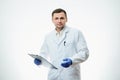 A male caucasian doctor in a white lab coat and blue disposable medical gloves Royalty Free Stock Photo