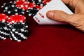 A male caucasian hand Showing a Pair of Aces in the hole, Hearts and Diamonds, a standard red and white deck of cards Royalty Free Stock Photo