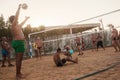 male Caucasians, Arabs, Africans playing volleyball on the beach Royalty Free Stock Photo