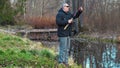 Male cease fishing near river