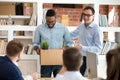 Male CEO introduce black newcomer to work team at briefing Royalty Free Stock Photo