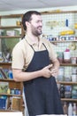 Male Ceramist In Workshop. During a Working Process. Having Laugh and Holding A Piece of Clay