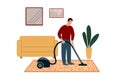 Male character during housework, housekeeping. Person cleans carpet, floor with vacuum cleaner in living room interior. Royalty Free Stock Photo