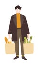 Male character shopping groceries. Man carrying full paper bags with food in both hands. Vector illustration isolated on