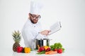 Male chef cook in glasses holding receipe book Royalty Free Stock Photo