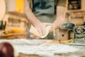 Male chef cooking dough and prepares pasta machine Royalty Free Stock Photo