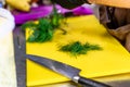 Male Chef Cutting Dill on Yellow Board Royalty Free Stock Photo