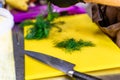 Male Chef Cutting Dill on Yellow Board Royalty Free Stock Photo