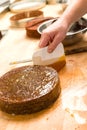 Male chef decorating chocolate cake in kitchen