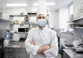 Male chef with in face mask at restaurant kitchen Royalty Free Stock Photo
