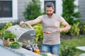 Male chef grilling and barbequing in garden. Barbecue outdoor garden party. Handsome man preparing barbecue meat Royalty Free Stock Photo