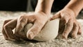 Male chef hands knead dough with flour on kitchen table Royalty Free Stock Photo