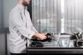 Male chef hands with knives. Closeup professional testing kitchen staff.