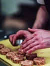 Male Chef Making Round Pork Cutlet for Some Burgers for Wedding Meal