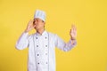 male chef with okay hand gesture while tasting delicious food