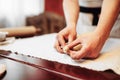 Male chef prepares apple strudel, bakery cooking Royalty Free Stock Photo