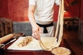 Male chef prepares dough for apple strudel Royalty Free Stock Photo