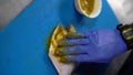 Male chef preparing pomfret fish for marinette. Cooking fish in kitchen. Preparation of ingredients by chef to prepare dish.