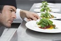 Male Chef Preparing Salad In Kitchen Royalty Free Stock Photo