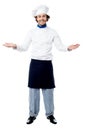 Male chef in uniform welcoming guests