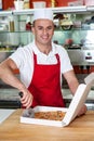 Male chef using pizza cutter Royalty Free Stock Photo