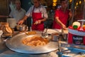 Male chefs deep frying food on Istiklal street in Istanbul