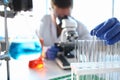 A male chemist holds test tube of glass in his hand Royalty Free Stock Photo