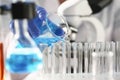 A male chemist holds test tube of glass in his hand Royalty Free Stock Photo