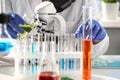 A male chemist holds test tube of glass in his hand Royalty Free Stock Photo