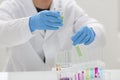 A male chemist holds test tube of glass Royalty Free Stock Photo