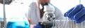 A male chemist holds test tube of glass in his hand Royalty Free Stock Photo