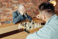 Male chess players playing, white wins, mate Royalty Free Stock Photo