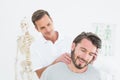 Male chiropractor doing neck adjustment Royalty Free Stock Photo
