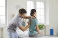 Chiropractor, osteopath or physiotherapist working with young woman who has scoliosis