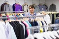 Male choosing t-shirts in the shop Royalty Free Stock Photo