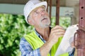 male civil engineer checking projects on construction site Royalty Free Stock Photo