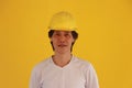 Male civil engineer with yellow helmet and wear white T-shirt on yellow background