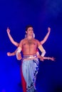 Male Classical Odissi dancer performing Odissi Dance on stage at Konark Temple, Odisha, India. Royalty Free Stock Photo