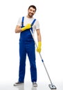 male cleaner in overal cleaning floor with mop Royalty Free Stock Photo