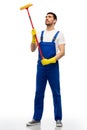 male cleaner in overal with window cleaning mop Royalty Free Stock Photo