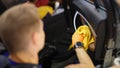 Male cleaner wiping dust in interior of car with microfiber cloth closeup Royalty Free Stock Photo