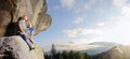 Male climber climbing big boulder in nature with rope Royalty Free Stock Photo