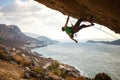 Male climber climbing overhanging rock