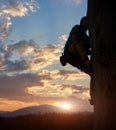 Climber silhouette climbing, challenging rocky route. Sunset in mountains. Extreme, activity, rock climbing. Copy space Royalty Free Stock Photo