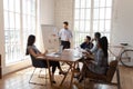 Male coach make whiteboard office presentation to diverse employees Royalty Free Stock Photo